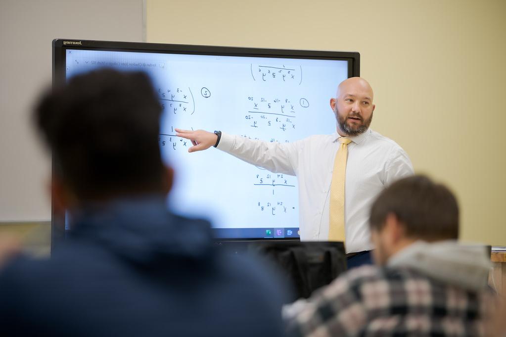 Jordan Haas, instructor of mathematical sciences, teaches a course in the Burkhiser Complex in April 2022.